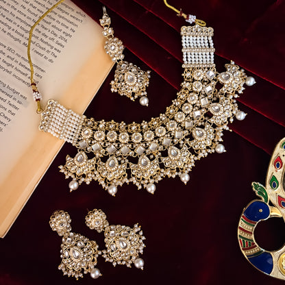 Maisha premium antique gold kundan broad choker necklace set featuring linked tracks of clear dabi stones a dense cascading fringe of pastel pink and mint green quartz beads with matching tiered earrings and maang tikka