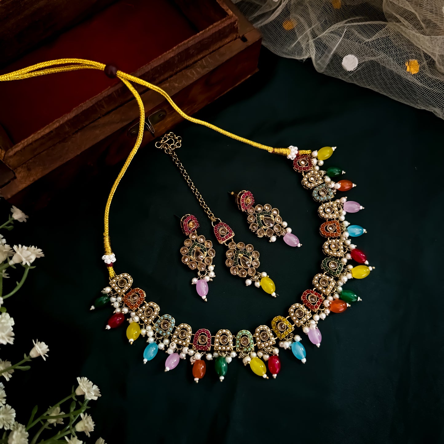Nitika  Jadau Reverse AD Sleek Multi Necklace Set with Earrings & Teeka
