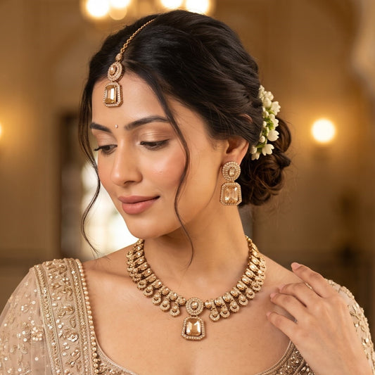 Anandita premium antique gold zircon necklace set featuring a linked tracking of circular flower rosette stones a large central square champagne gold drop pendant matching dropdown earrings and maang tikka