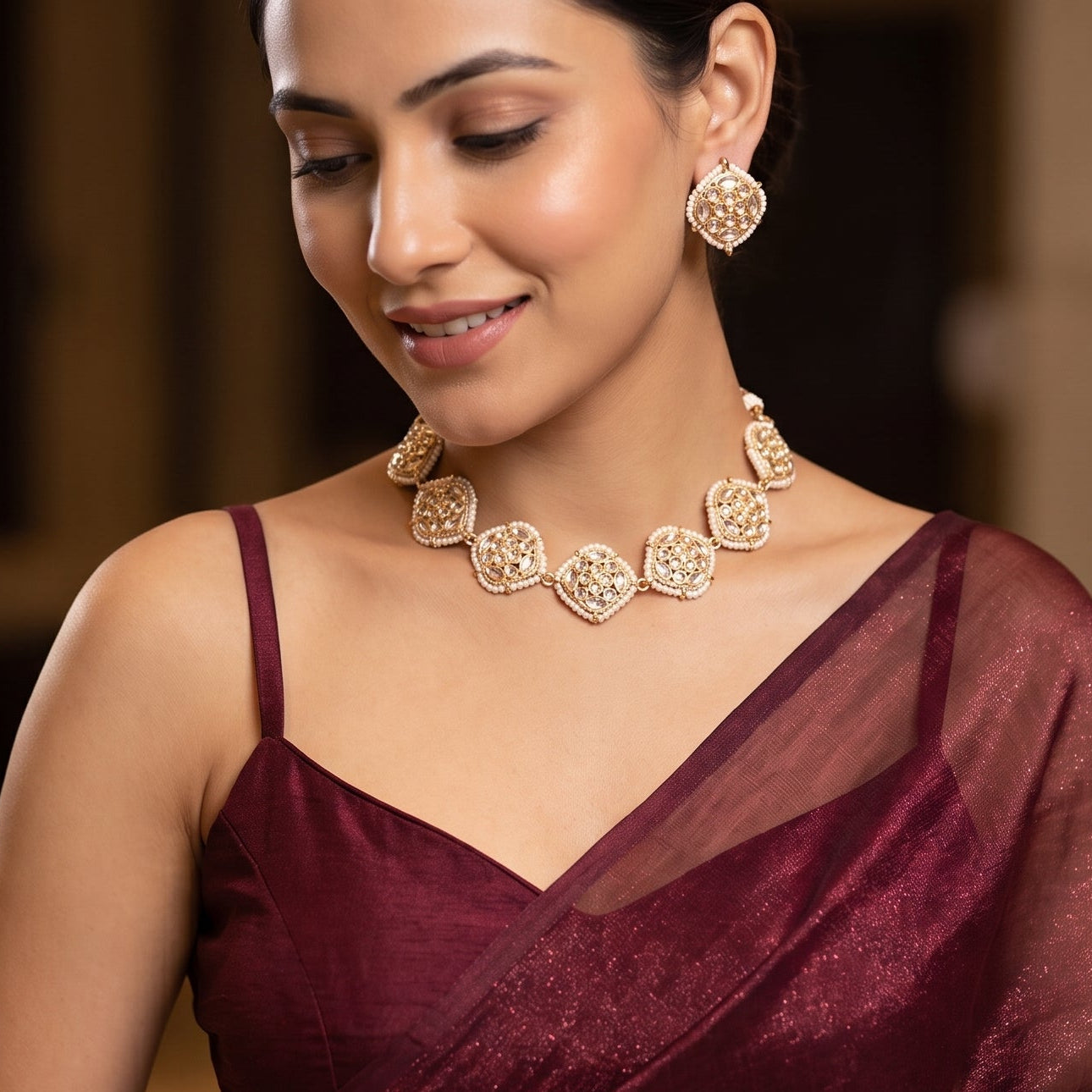 Ananya premium antique gold kundan broad choker necklace set featuring a linear linked tracking of square rosette dabi stones with white seed pearl borders and matching stud earrings