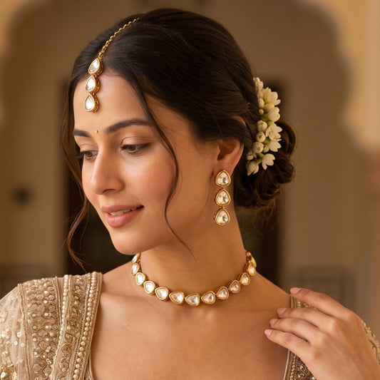 premium antique gold kundan three layer necklace set featuring three parallel cascading tracks of round flower rosette dabi stones matching tiered drop earrings and a maang tikka