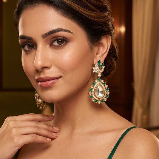 Mansi premium antique gold kundan chandelier earrings featuring pastel mint green marquise leaf studs an asymmetric pavé crystal scroll a large teardrop pendant with a central clear dabi stone and a mint green kemp halo