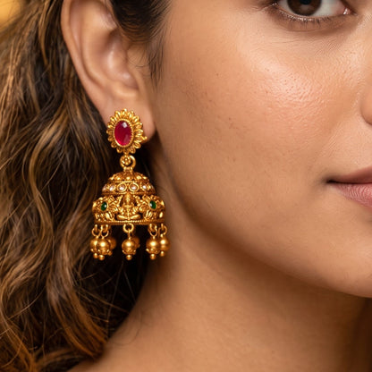 Vaidehi Navratan Temple premium antique gold hasli choker necklace set featuring a rigid torque band with embossed goddess and peacock motifs clear multicolored stones and matching drop earrings