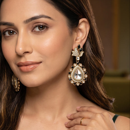 Mansi premium antique gold kundan chandelier earrings featuring pastel mint green marquise leaf studs an asymmetric pavé crystal scroll a large teardrop pendant with a central clear dabi stone and a mint green kemp halo
