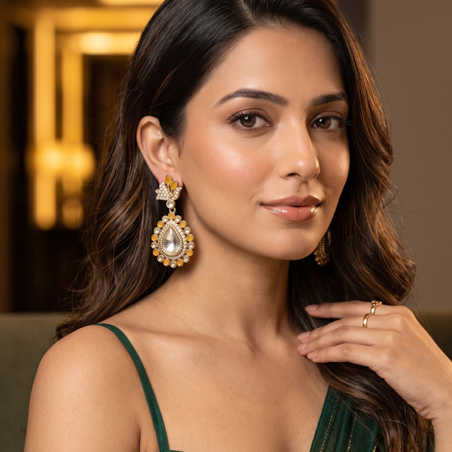 Mansi premium antique gold kundan chandelier earrings featuring pastel mint green marquise leaf studs an asymmetric pavé crystal scroll a large teardrop pendant with a central clear dabi stone and a mint green kemp halo