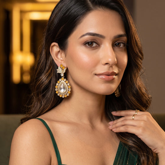 Mansi premium antique gold kundan chandelier earrings featuring pastel mint green marquise leaf studs an asymmetric pavé crystal scroll a large teardrop pendant with a central clear dabi stone and a mint green kemp halo
