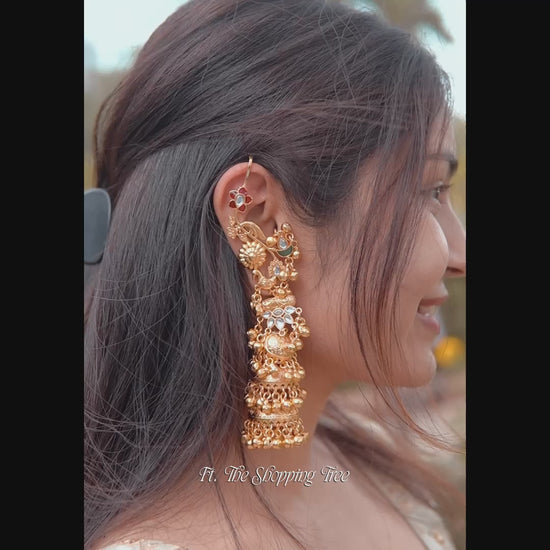Neelkanchi premium kashmiri brass three tier jhumka earrings featuring over the ear hooks with twin peacock carvings and tiny ghungroo beads