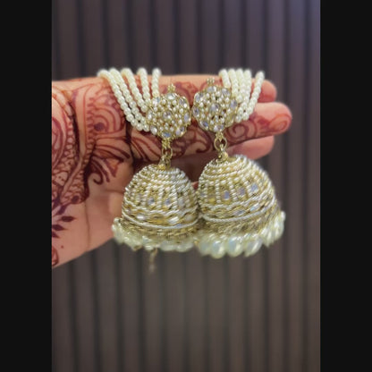 Traditional antique gold reverse american diamond bridal earrings featuring classic white pearls with cascading teardrop drops and pearl sahara support chains