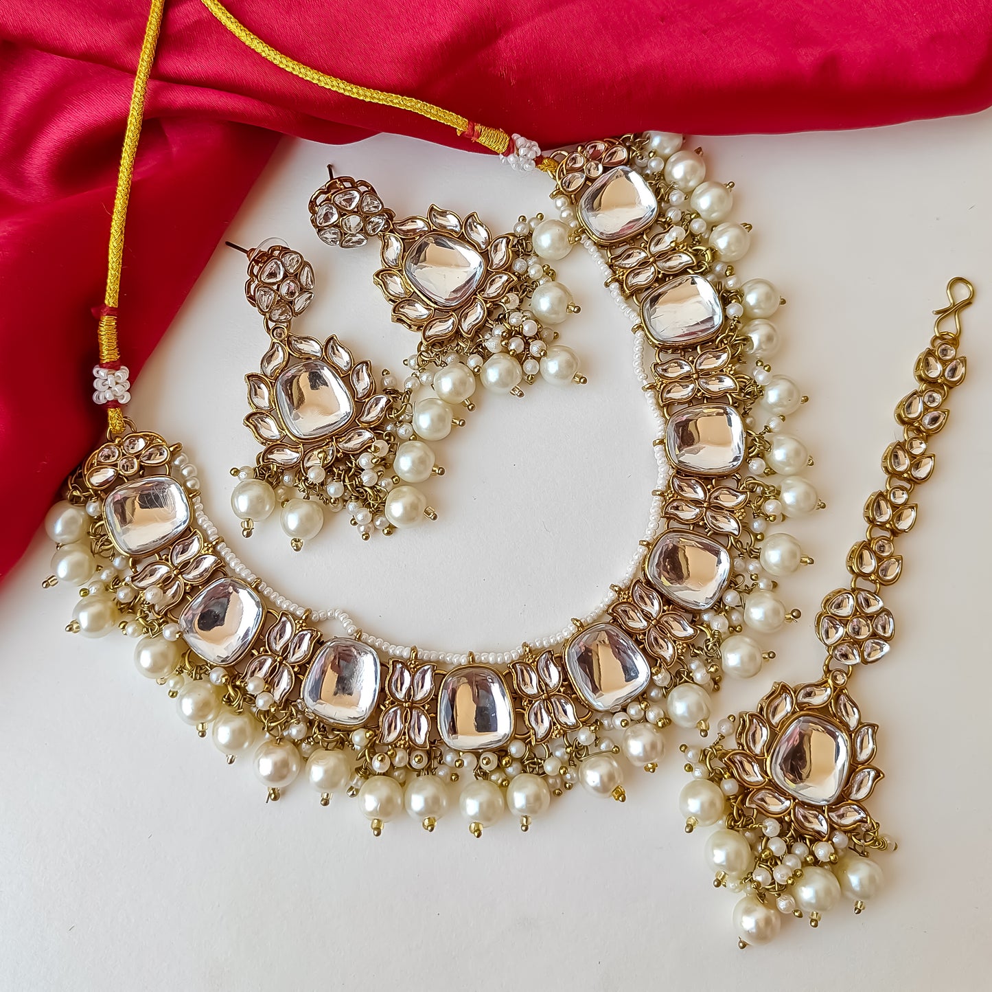 Rajvi Kundan Necklace Set with Earrings & Tika